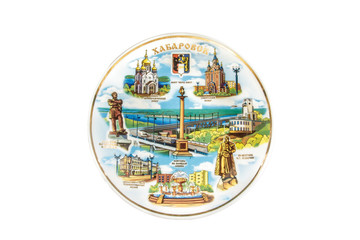 Wall Mural - ceramic souvenir toy in the form of plate with color painting on isolated white background reflecting the national Russian culture with the inscription in Russian: the name of the city of Khabarovsk