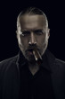 Badass character man with cigar on black, shallow depth of field
