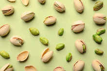 Composition With Organic Pistachio Nuts On Color Background, Flat Lay