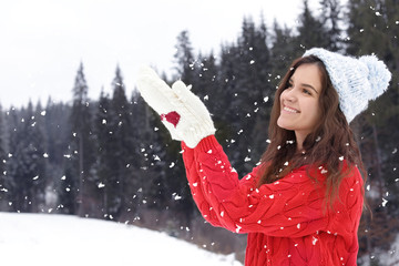 Sticker - Happy young woman in warm clothes outdoors. Winter vacation