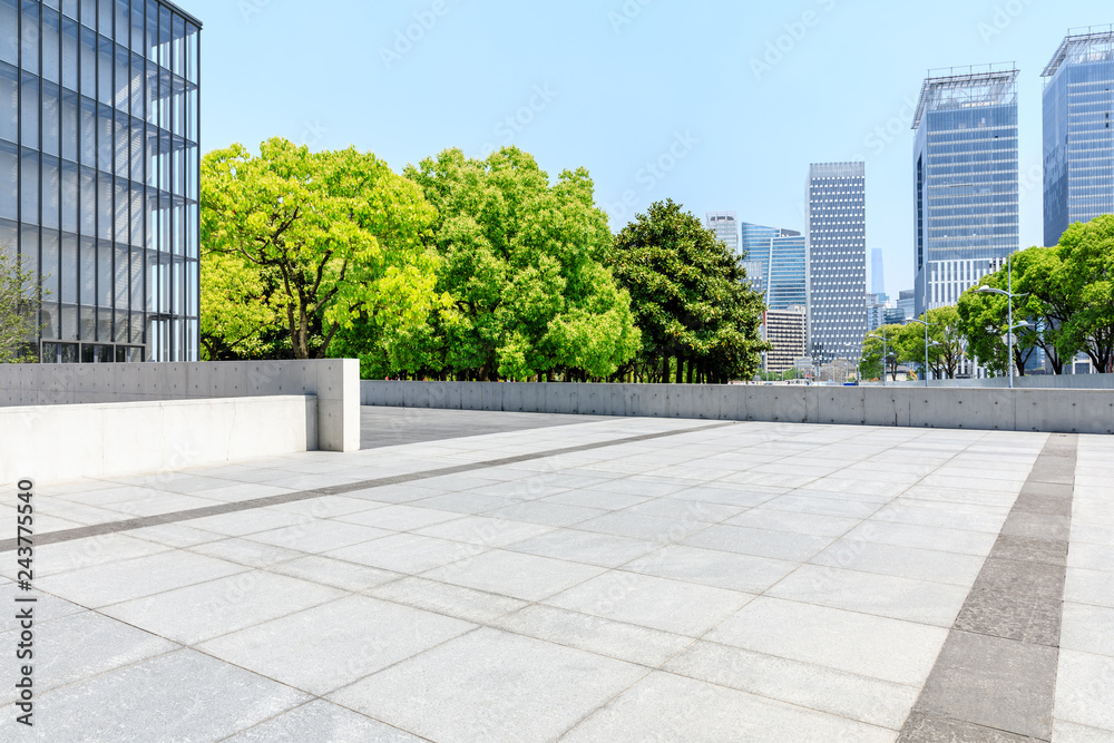 City square floor and modern commercial building in Shanghai - obrazy, fototapety, plakaty 
