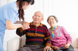© Tom Wang - Health visitor and  senior couple during home visit