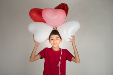 Boy  sibling with balloon  heart shape of love