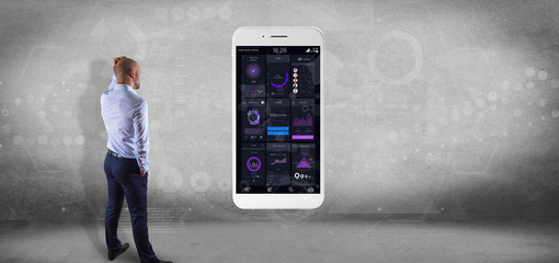 Poster - Businessman in front of a wall with Smartphone with user interface data on the screen isolated on a background