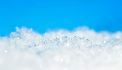 natural many crystals of snowflakes of various shapes and texture shimmer on sun on a clear winter d