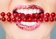 © artmim - Red lips and white healthy teeth with bright pearls closeup. Perfect female smile with glitter lipstick makeup