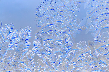 Snow patterns on glass as an abstract background