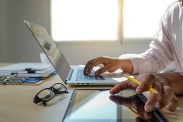 Poster - double exposure of business man hand working on laptop computer on wooden desk with social media network diagram