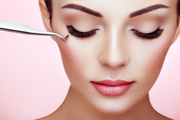 Wall Mural - beautiful woman with extreme long false eyelashes. eyelash extensions. makeup, cosmetics. beauty, sk