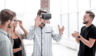 Young doctor watching male in VR goggles