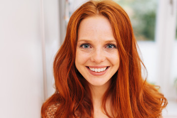 Young red-haired woman close-up portrait