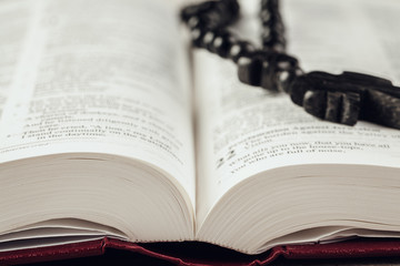 Sticker - Bible and a crucifix on an old wooden table. Religion concept.