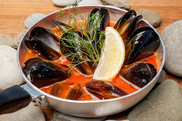 Wall Mural - Dish from mussels on stones