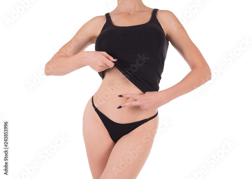 Fotografie, Obraz Female cropped fit body in black tank top and panties, isolated on white