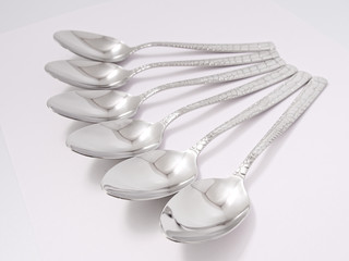 silverware forks spoons knives cutlery on a white background