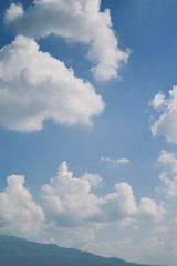 Wall Mural - white cloud on clear blue sky above the mountain