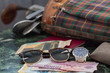 watch, sunglasses, money, golf equipment on a table of marble