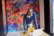 © Andy Paul - Senior black creative professional presenting in a meeting