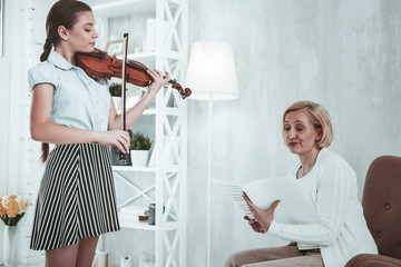 Wall Mural - Unhappy cheerless woman listening to her student