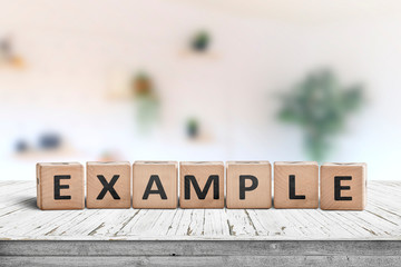 example sign on a wooden table in a bright room