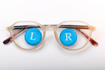 Sticker - Eyeglass frame in which the caps are from contact lenses. The concept of poor vision. Isolated