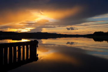 Wall Mural - sunset over river in summer.