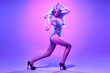 © evgenij918 - Disco Party Doll girl with Purple hairstyle dance. High Fashion. Young Gorgeous model woman in Colorful neon Light. Night Clubbing. Music vibes. Pop Art Style