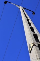 High voltage tower with warning sign