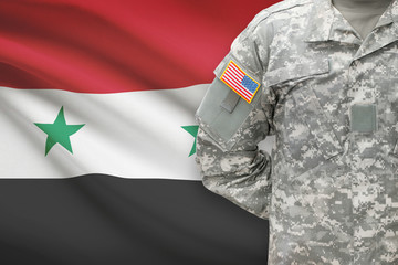 American soldier with flag on background - Syria