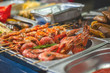 grilled prawns on grill. street food