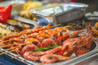 grilled prawns on grill. street food