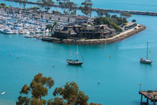 View Of Beautiful Marina With Large Sailboat In Blue Lagoon