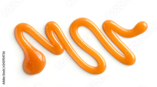 Fotografía caramel sauce on white background