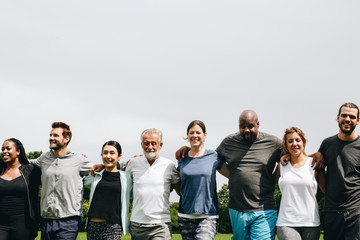 Group of people hugging each other in the park