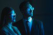 © Artem - The business couple standing in the dark room