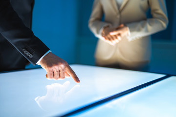 Poster - The woman and a man working with a sensor screen