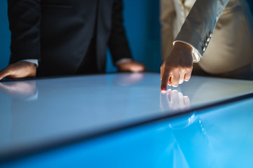 Poster - The man and a woman working with a sensor screen