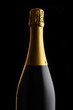 Unopened bottle of Champagne against a black background