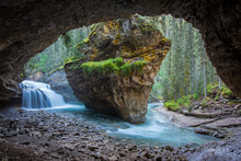 Johnston Canyon Cave In Spring Season With Waterfalls, Johnston Canyon Trail, Alberta, Canada