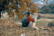 © SHOTPRIME STUDIO - woman with a dog in the mountains in autumn