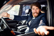 © SHOTPRIME STUDIO - business man with a beard riding a car talking