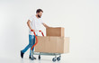 © SHOTPRIME STUDIO - man carries a cart with boxes moving