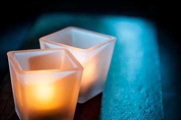 Two Lighted Candles on Table