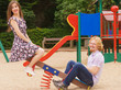© Voyagerix - Funny couple playing on playground