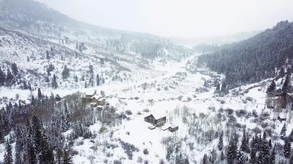 Affiche - Aerial view of rural mountain community in the Winter.