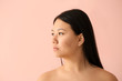 © Pixel-Shot - Portrait of young Asian woman with acne problem on color background