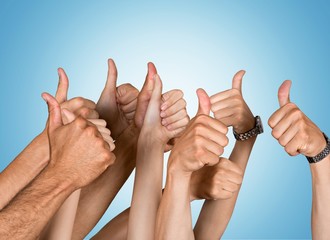 Businessman showing thumbs up  over blue background