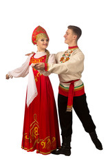 Wall Mural - Beautiful caucasian cuple dancing in Russian folk costumes isolated on white