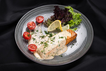 Fish steak salmon grilled with fresh salad