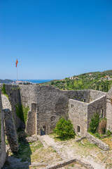 Sticker - Medieval stone fortress is located high in the mountains.